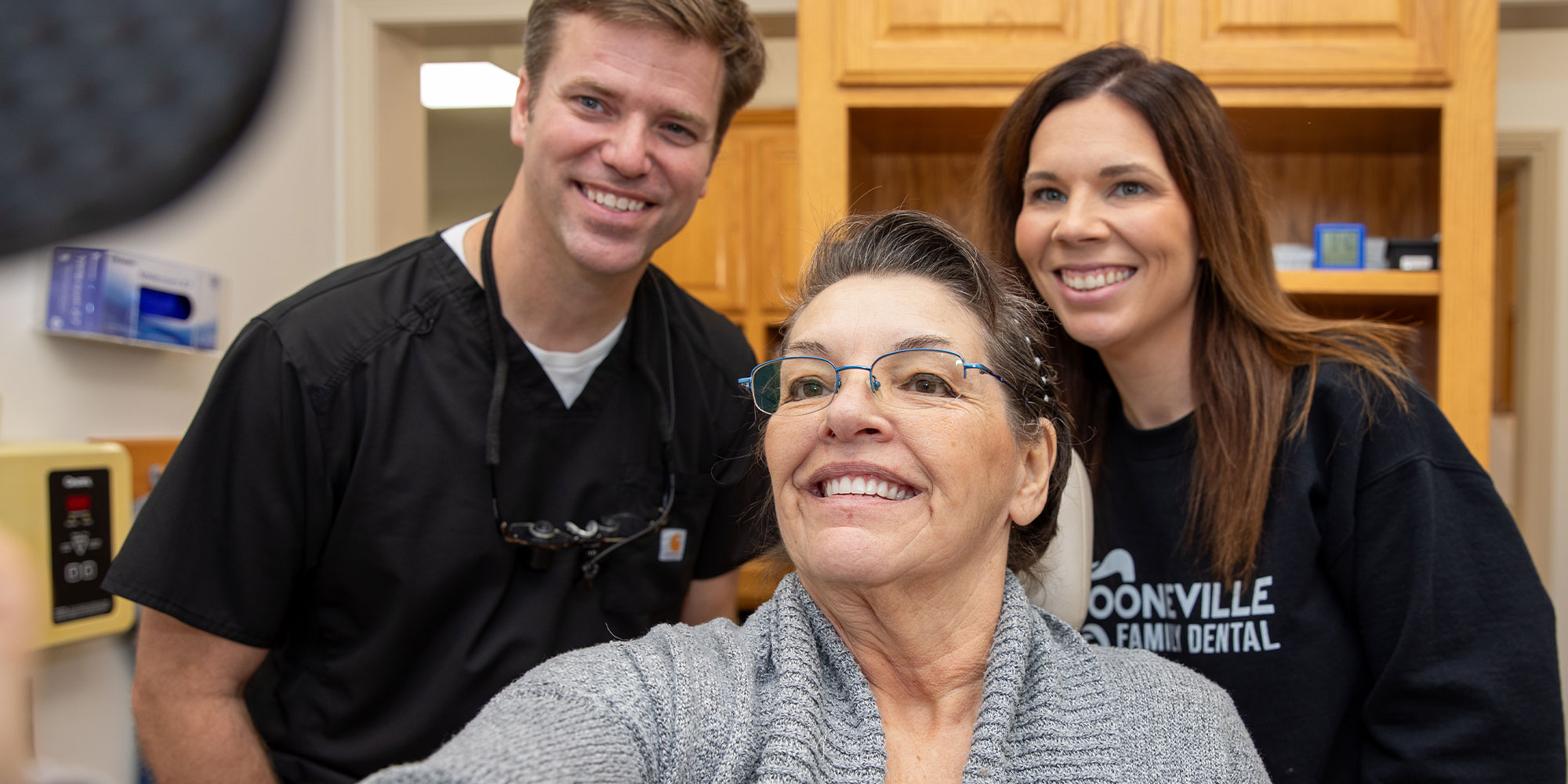 team with dental patient during smile reveal