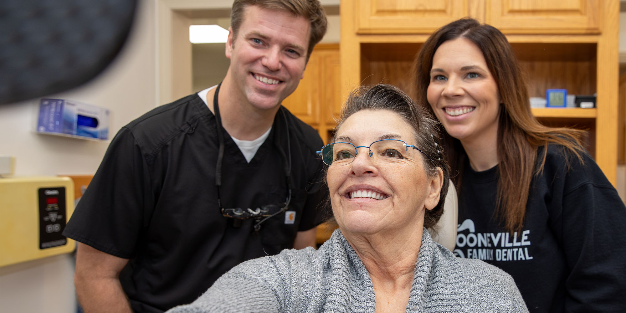 team with dental patient during smile reveal