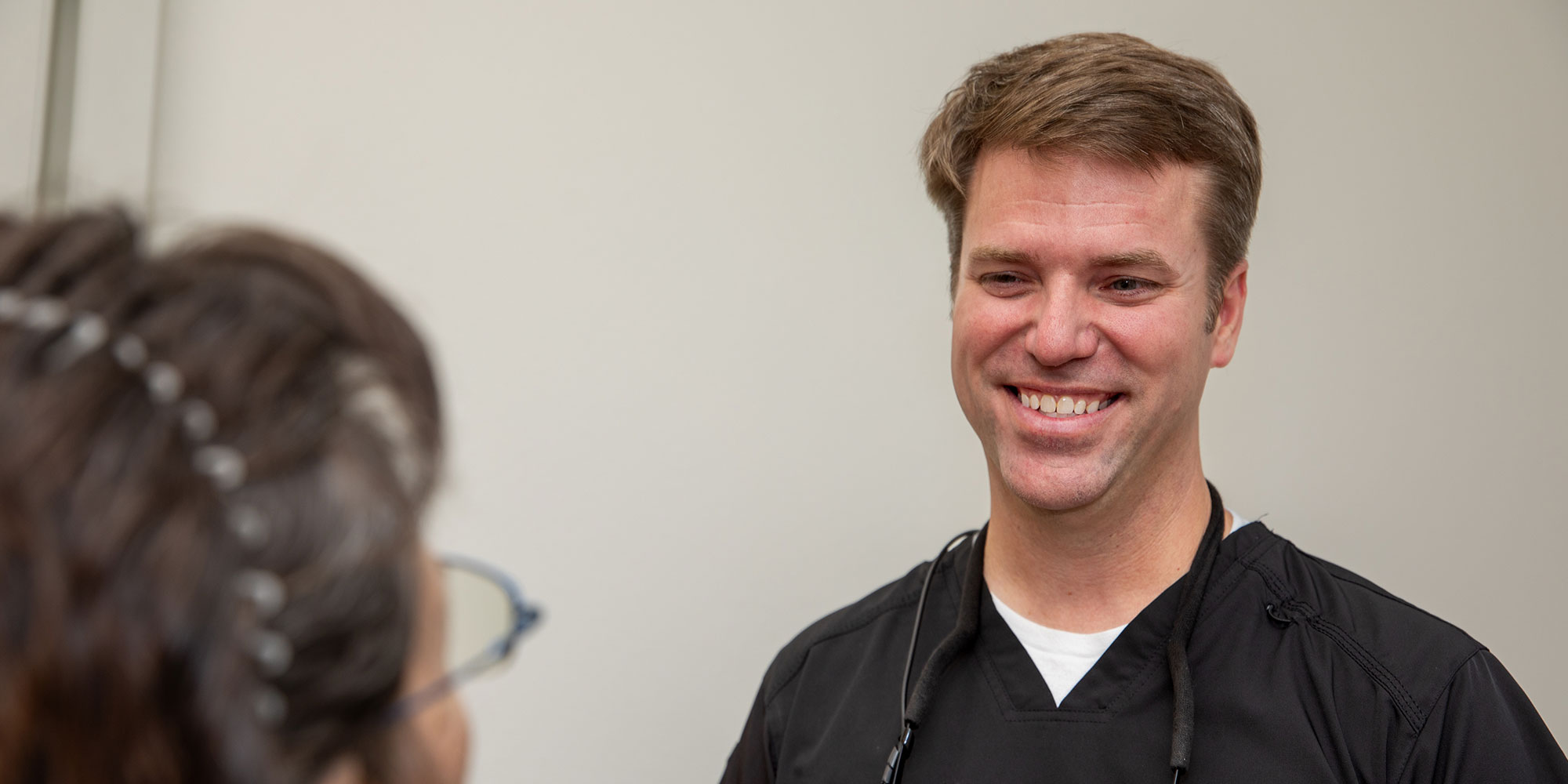 doctor talking patient thru dental implants