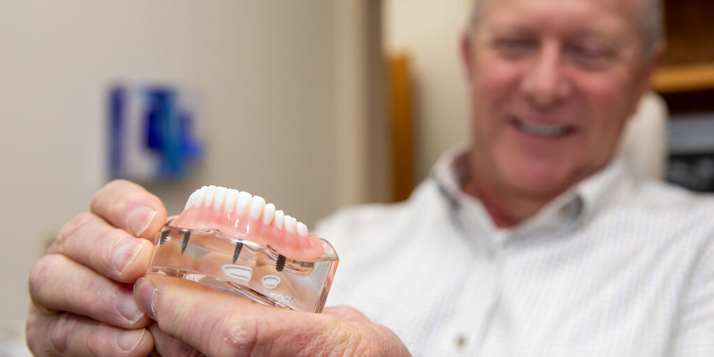 full arch model being held