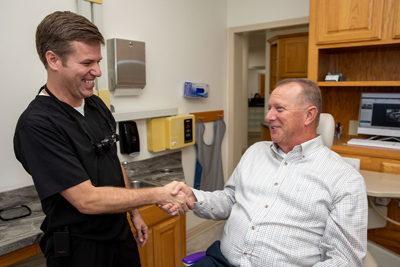 happy dental patient with service and results