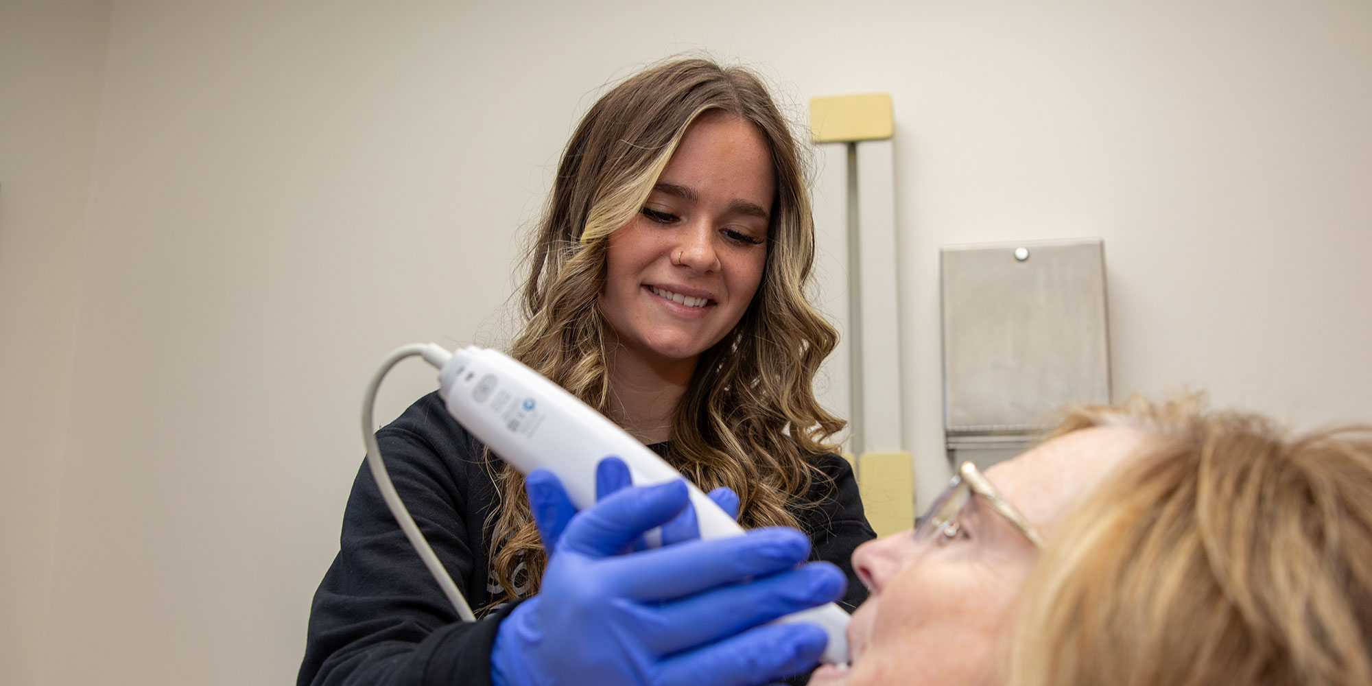 team member uses itero to scan