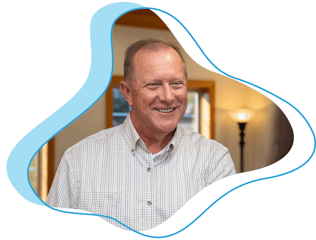 man at desk talking to office manager